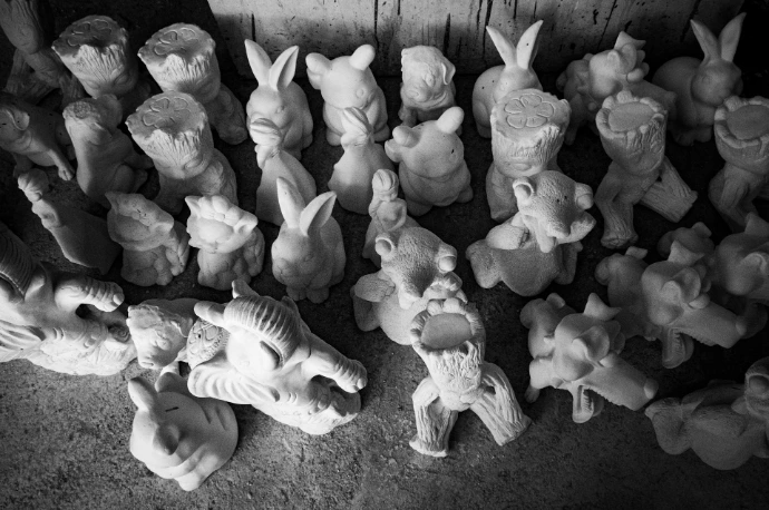a group of small figurines sitting on top of a floor